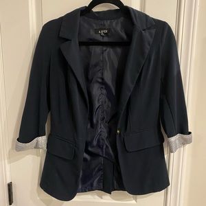 Blue blazer with cute polka dot detail. Small